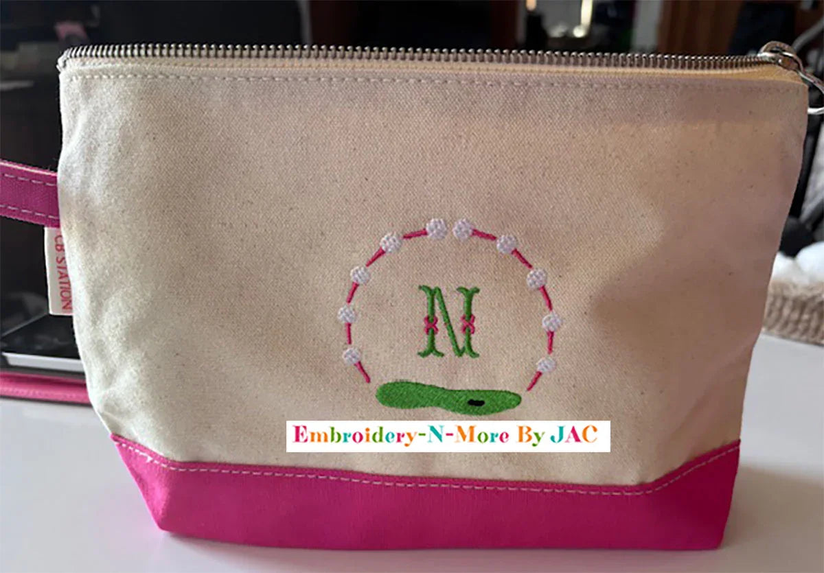 Personalized canvas and pink golf bag with embroidered letter N and golf course design