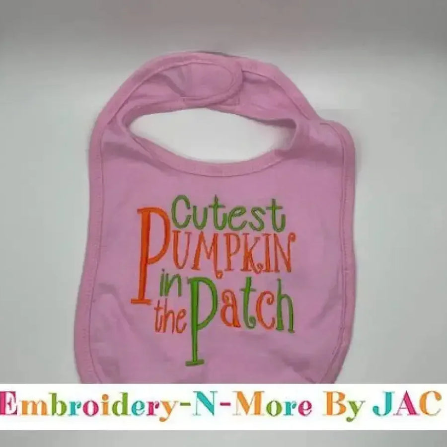 Pink baby bib with 'Cutest Pumpkin in the Patch' embroidered in orange and green letters