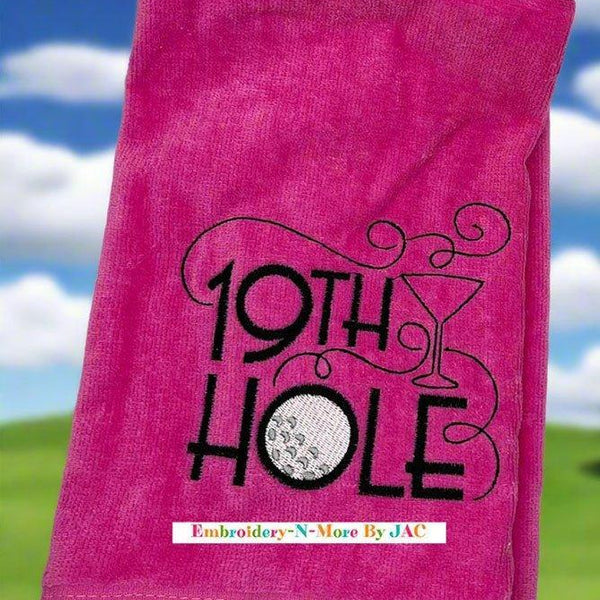 Pink tri-fold golf towel with embroidered 19th hole design, golf ball and martini glass