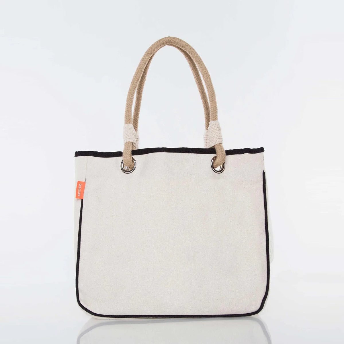 Beige canvas tote bag with rope handles and black trim, shown on a white background