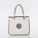 Personalized canvas tote bag with rope handles and black circle monogram design