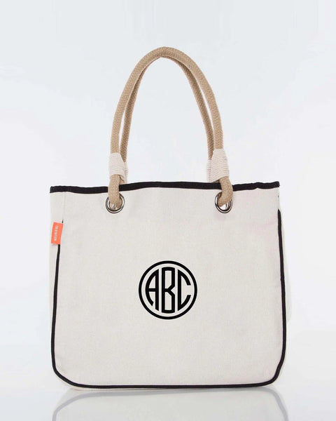 Personalized canvas tote bag with rope handles and black circle monogram design