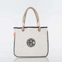 Personalized canvas tote bag with rope handles and black circle monogram design