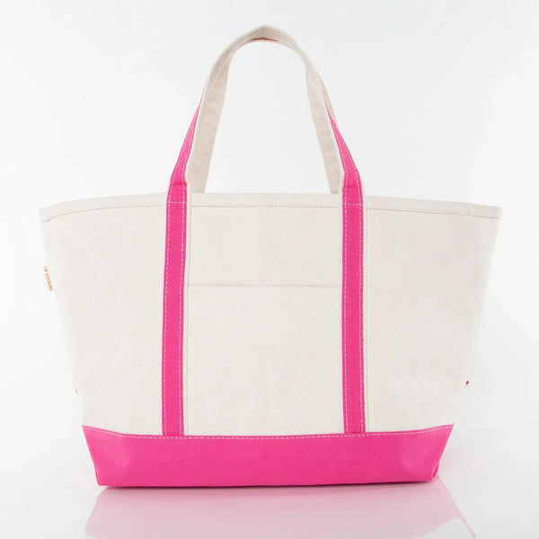 Canvas tote bag with pink handles and trim, front pocket, on a white background.