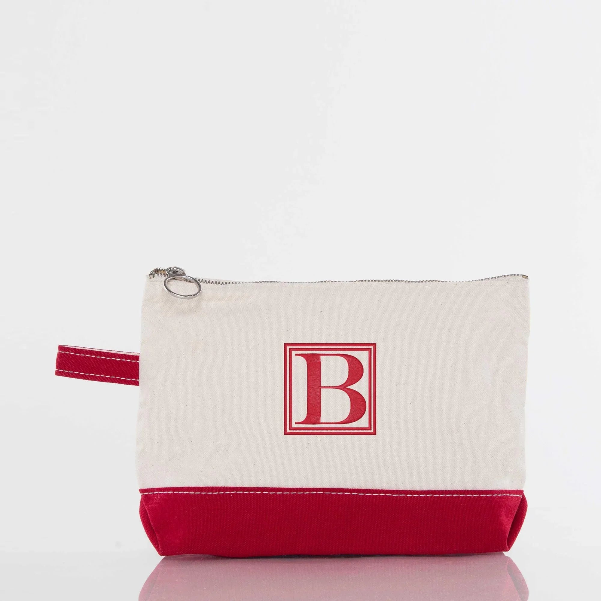 Canvas zipper bag with red bottom, red handle, and personalized red B monogram
