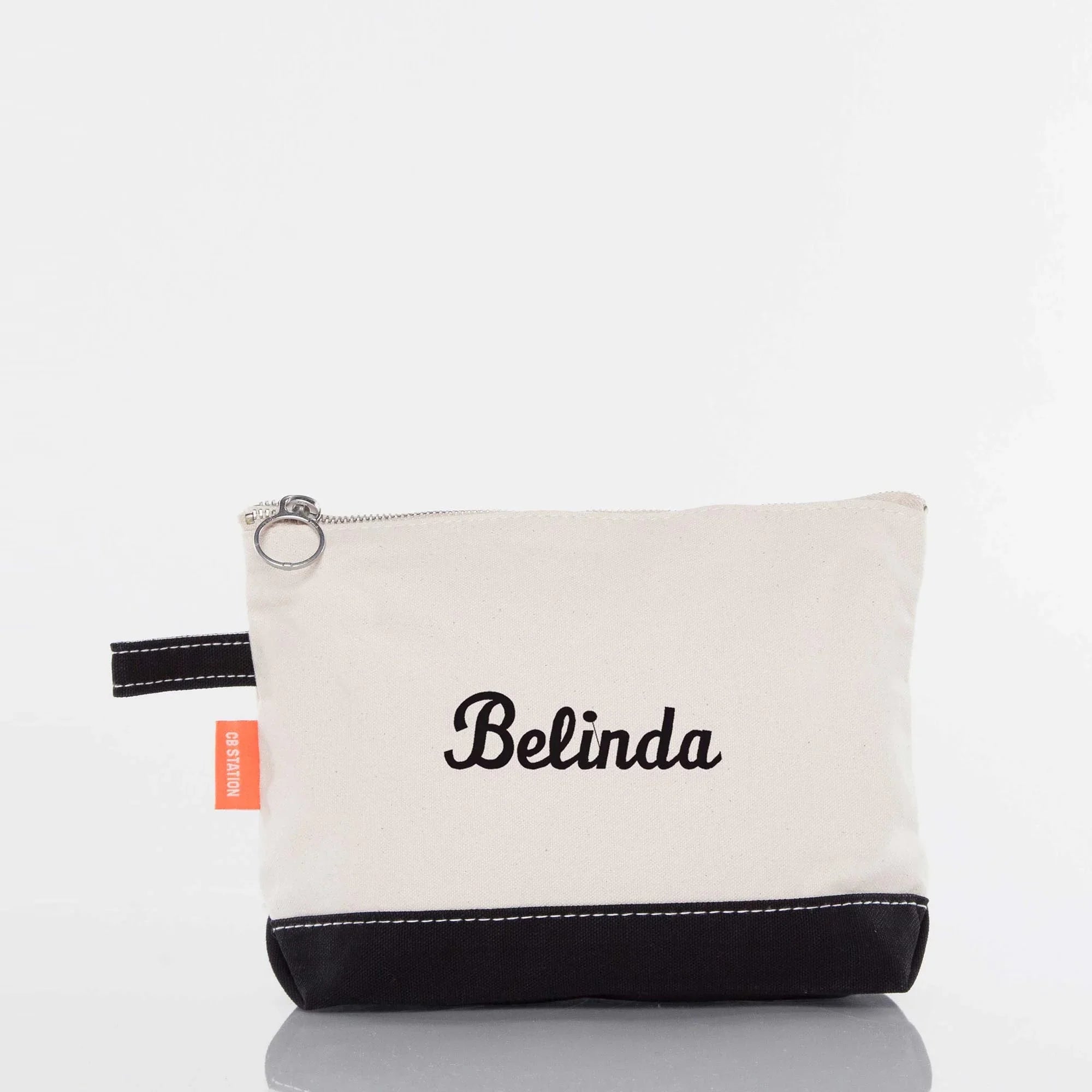 Personalized embroidered canvas pouch with black trim and zipper, name Belinda