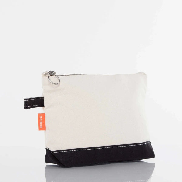 Canvas zippered pouch with black base and white top, orange tag, side view