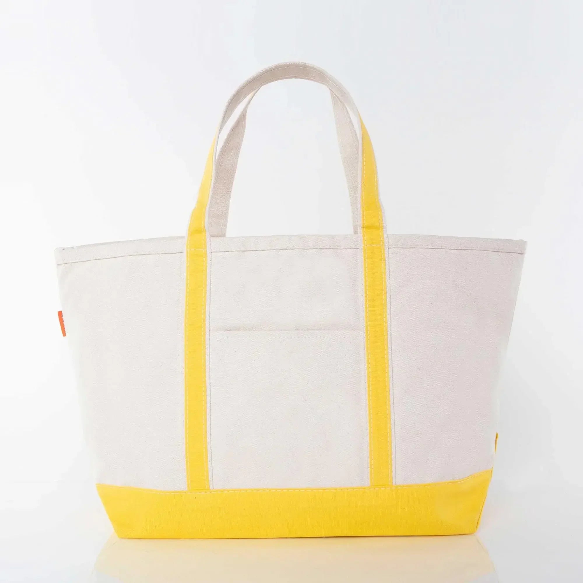 Canvas tote bag with yellow handles and base, front pocket, on white background