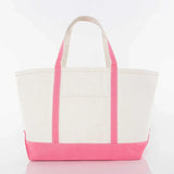 Canvas tote bag with pink handles and trim on a white background