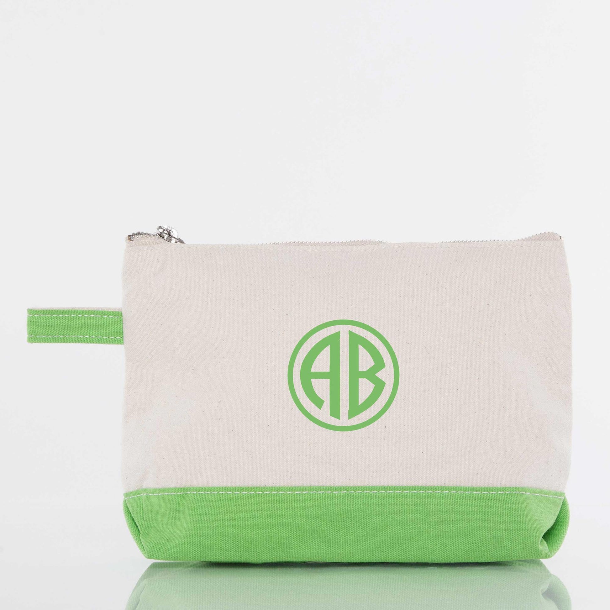 Personalized monogram zippered pouch with green trim and initials AB, canvas cosmetic bag
