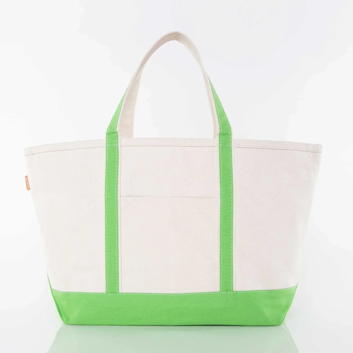 Canvas tote bag with green handles and base, front pocket, on white background