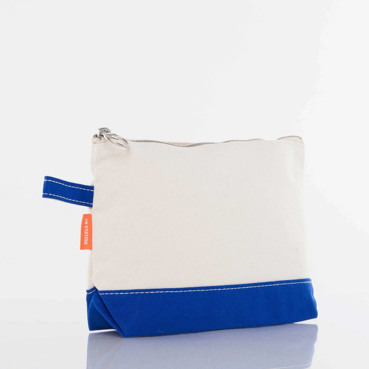 Canvas zippered pouch with blue bottom accent and stitched detail, side view