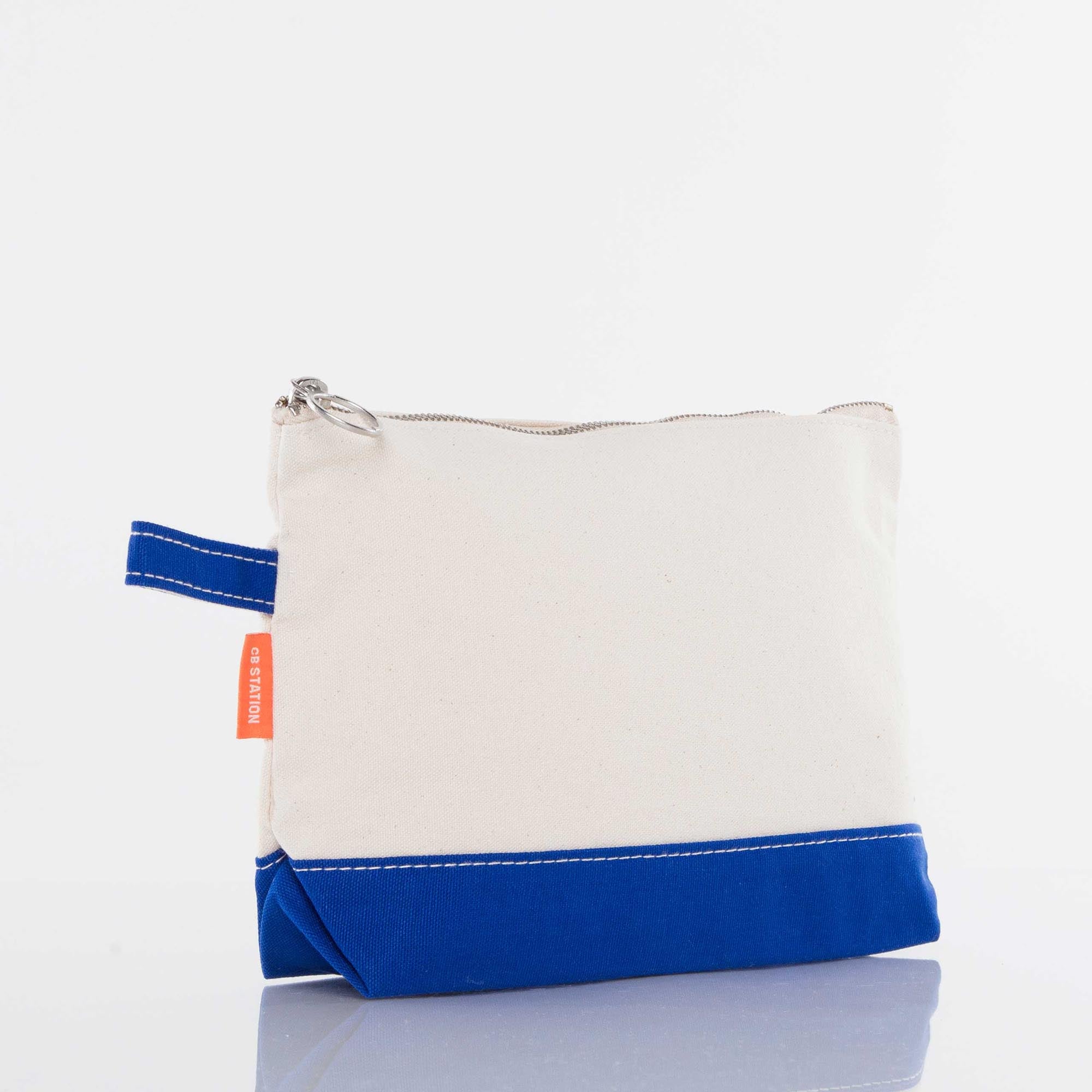 Canvas zip pouch with blue base, white upper, and side loop, ideal for custom embroidery gifts