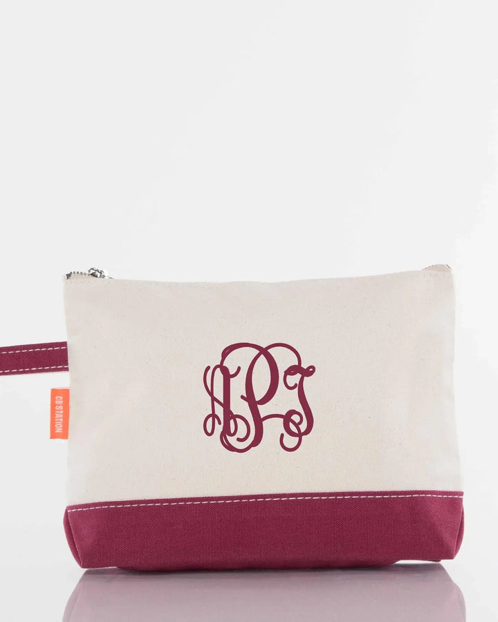 Personalized monogrammed canvas pouch with burgundy accent and zipper closure