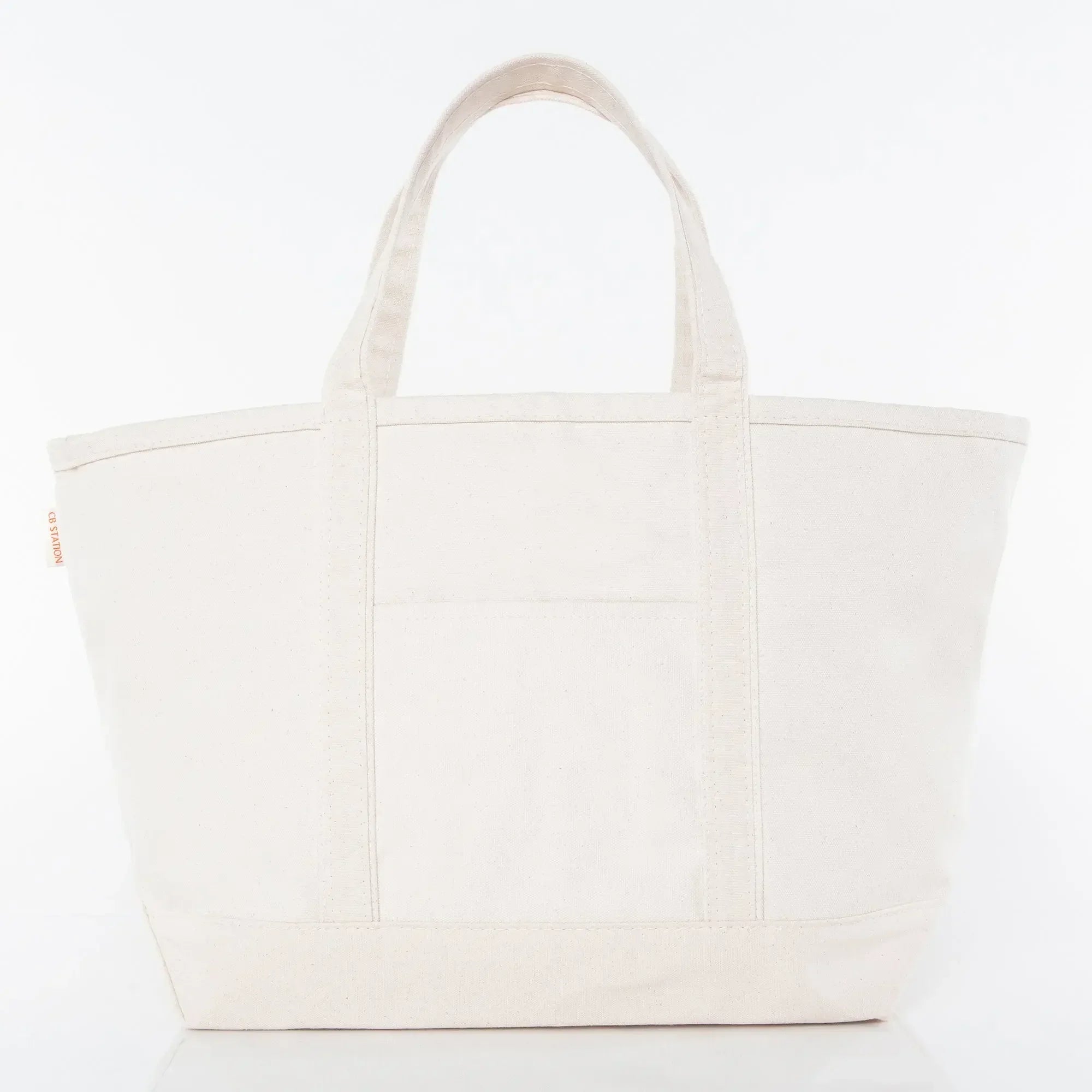 Large plain canvas tote bag with front pocket and two handles, ideal for custom embroidery.