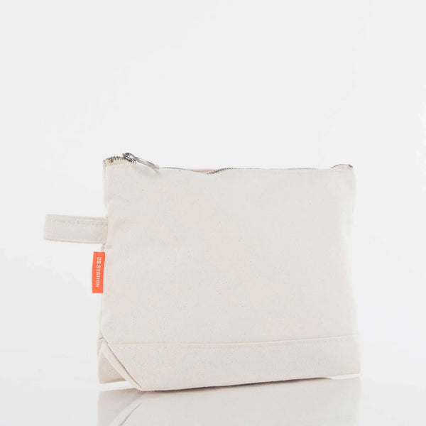 Natural canvas zippered pouch with side loop and orange tag, blank and ready for embroidery