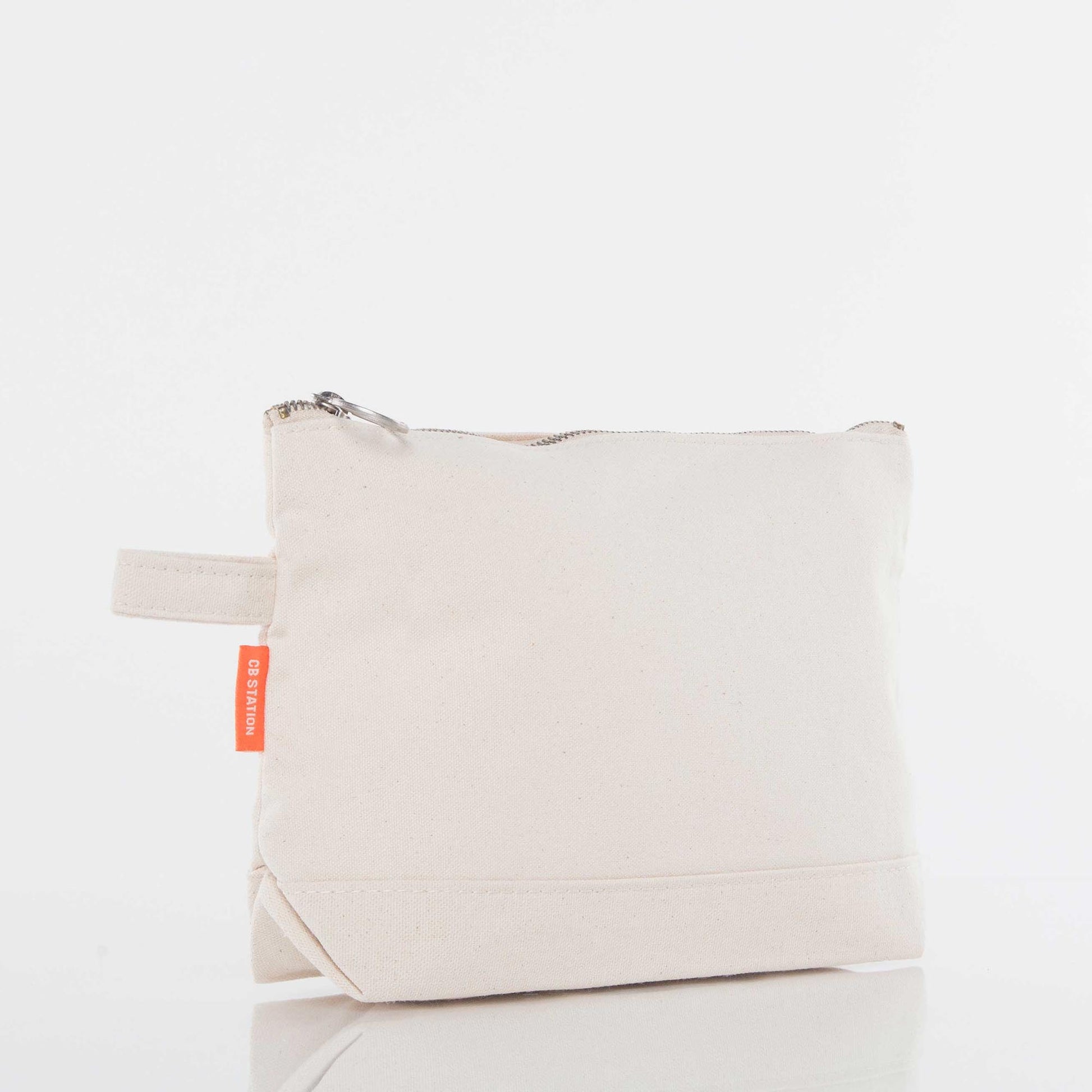 Blank canvas zipper pouch with side handle on white background