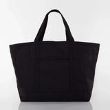 Black canvas tote bag with short handles and front pocket on white background