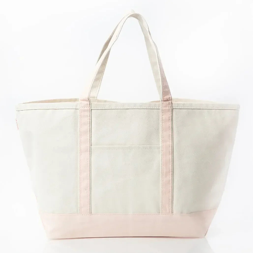 Large canvas tote bag with light pink handles and base on a white background