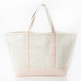 Large canvas tote bag with light pink handles and base on a white background