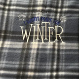 Plaid fleece blanket with embroidered I wasn't made for winter and snowflake design