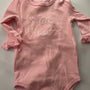 Personalized pink baby bodysuit with embroidered name Sofia Rose, long sleeves, snap closure