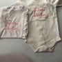 Personalized embroidered baby onesie and blanket with 'Future Doctor' in pink thread