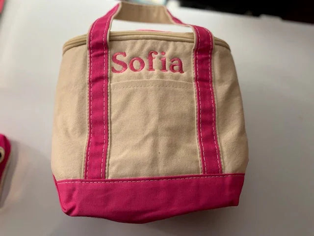 Personalized embroidered tote bag with pink handles and the name Sofia, custom canvas accessory