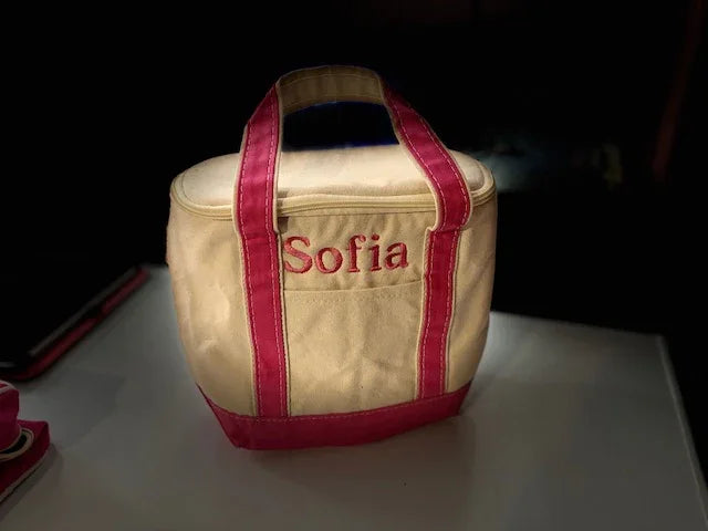 Personalized embroidered tote bag with pink trim and 'Sofia' name on cream fabric