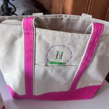 Personalized canvas tote bag with pink accents and embroidered initial M