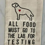 Embroidered kitchen towel with dog outline, heart detail, buffalo plaid border, and food testing quote