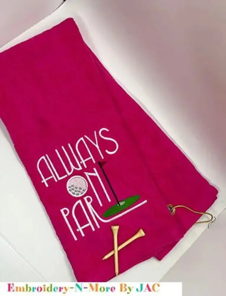 Red embroidered golf towel with 'Always On Par' text, golf tee and clip included.