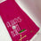Red embroidered golf towel with 'Always On Par' text, golf tee and clip included.