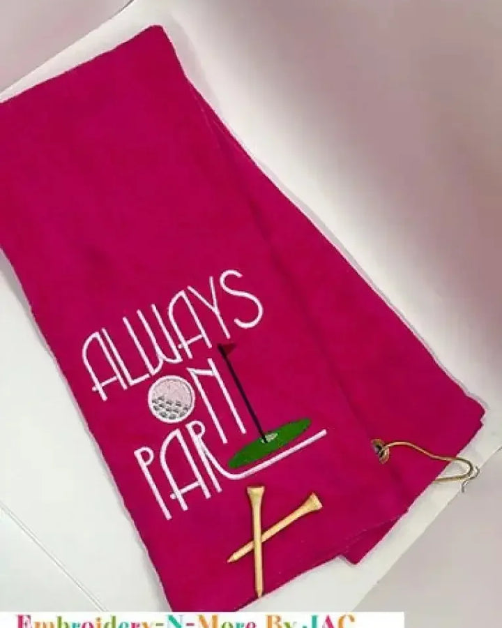 Red embroidered golf towel with 'Always On Par' text, golf tee and clip included.