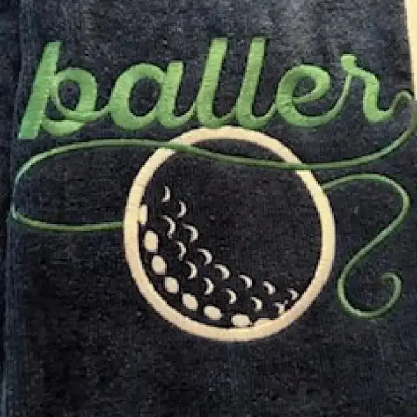 Embroidered golf towel with green baller text and white golf ball design