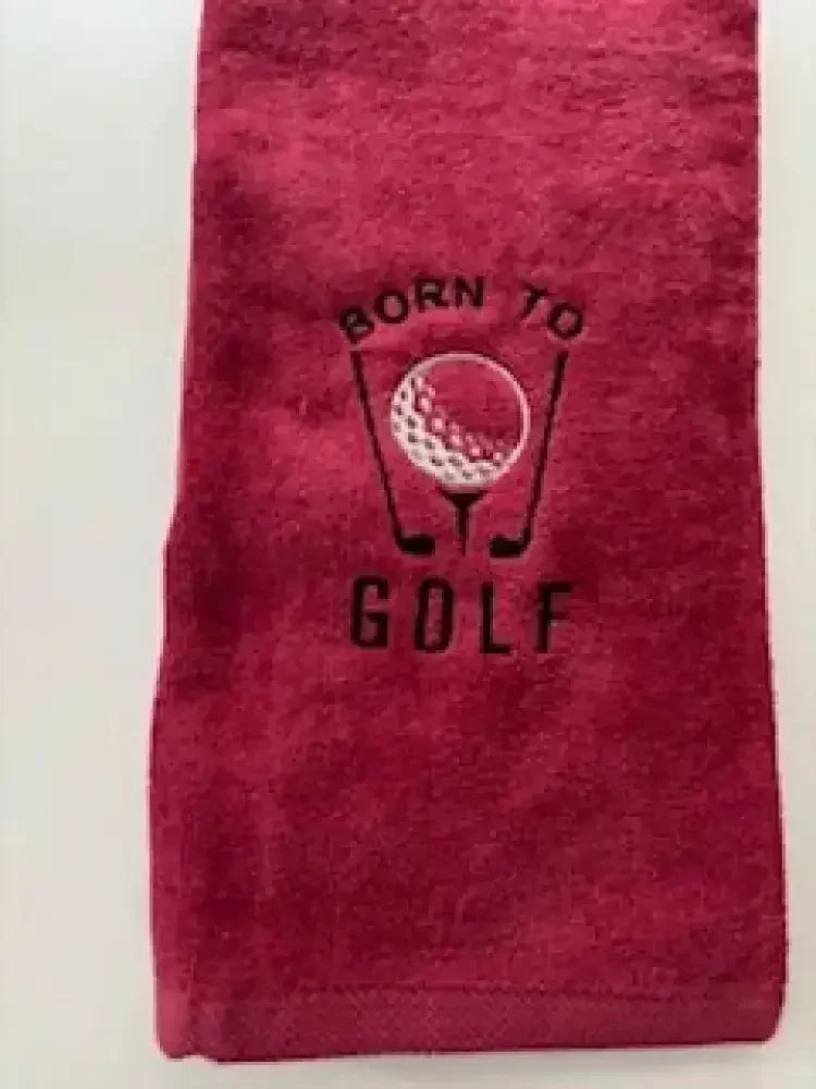 Red embroidered golf towel with 'Born to Golf' text and golf ball design