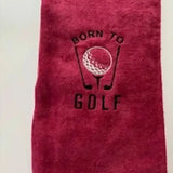 Red embroidered golf towel with 'Born to Golf' text and golf ball design