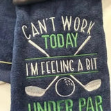 Embroidered navy golf towel with crossed clubs, golf ball, and humorous text design
