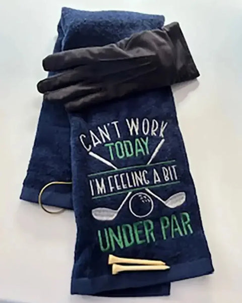 Navy embroidered golf towel with humorous 'Can't Work Today I'm Feeling Under Par' text, glove, and tees