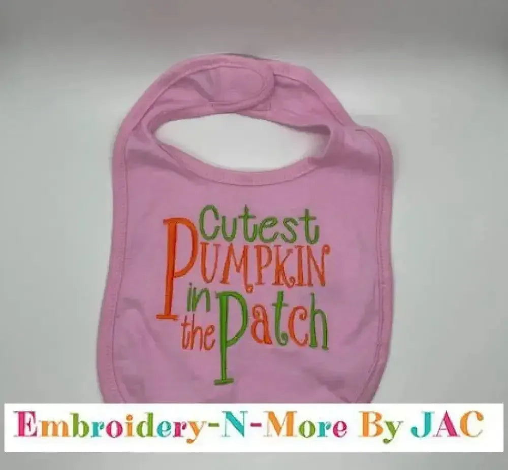 Pink baby bib with 'Cutest Pumpkin in the Patch' embroidered in orange and green letters