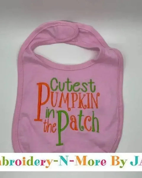 Pink baby bib with 'Cutest Pumpkin in the Patch' embroidered in orange and green letters