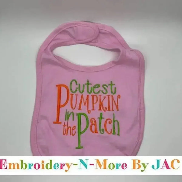 Pink baby bib with 'Cutest Pumpkin in the Patch' embroidered in orange and green letters
