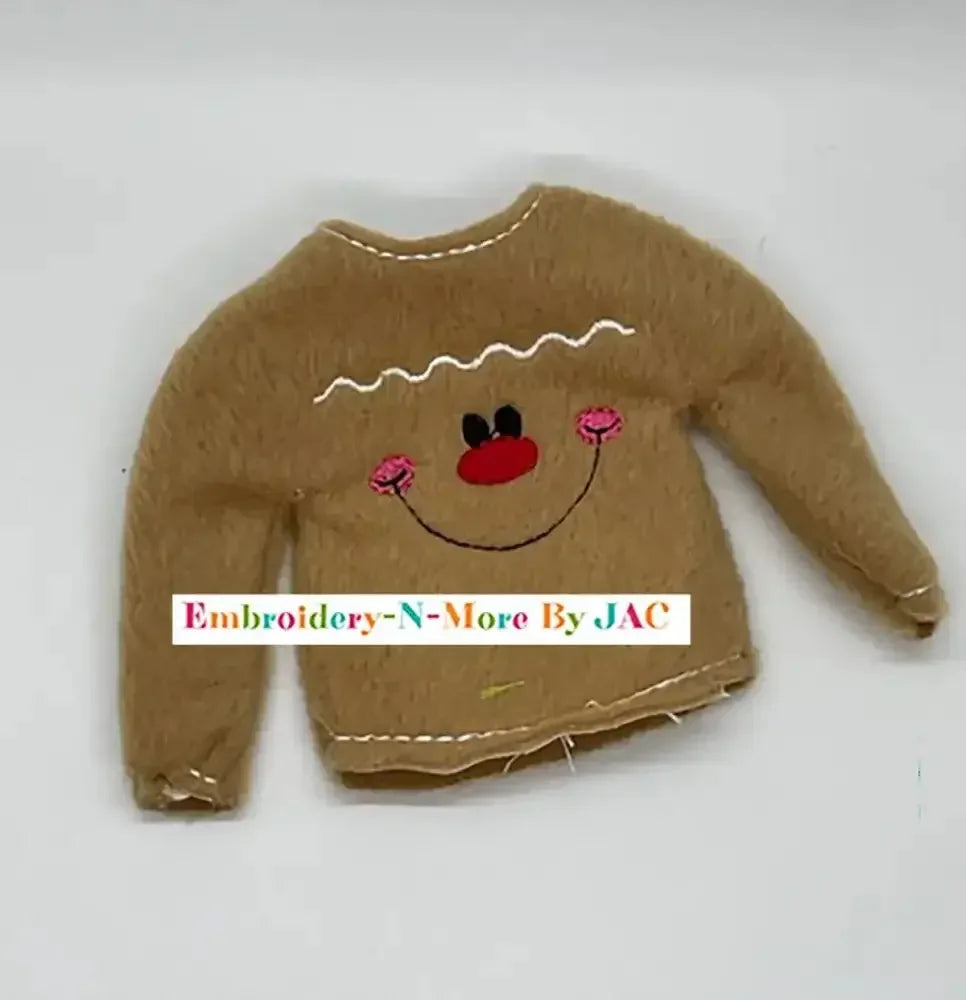 Brown embroidered gingerbread boy sweater with smiling face and pink cheeks, holiday accessory
