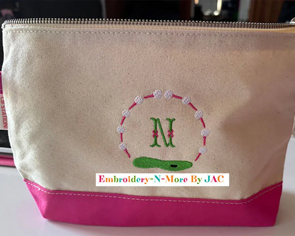 Personalized canvas and pink golf bag with embroidered letter N and golf course design