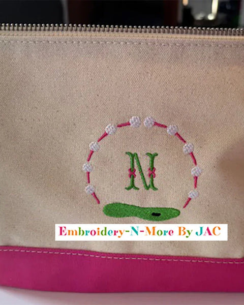 Personalized canvas and pink golf bag with embroidered letter N and golf course design