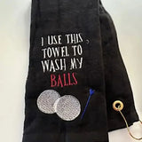 Black personalized golf towel with embroidered golf balls, tee, and humorous text.