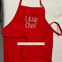 Red child apron with 'Little Chef' embroidered in white, perfect for kids cooking or baking.