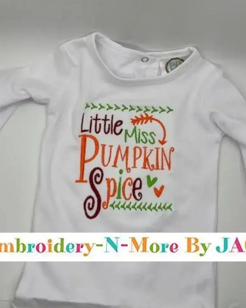 White baby bodysuit with colorful embroidered 'Little Miss Pumpkin Spice' text and leaf accents.