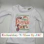 White baby bodysuit with colorful embroidered 'Little Miss Pumpkin Spice' text and leaf accents.