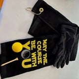 Black embroidered golf towel with yellow golf ball and tee, and 'May the Course Be With You' text